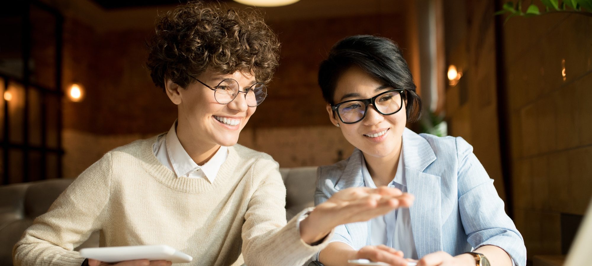 Two women sitting at a desk